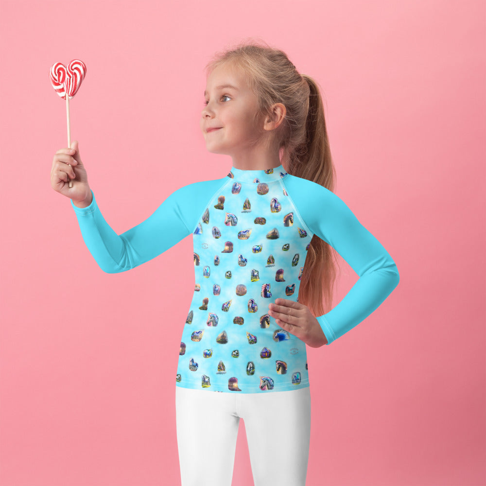 A picture of a girl wearing a "Ponies Unicorns & Fairy Houses" kids Rash Guard - front