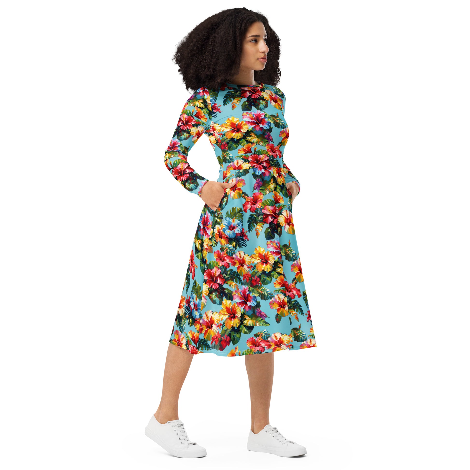 A picture of a woman modeling a Hawaiian Hibiscus Flower patterned long sleeve midi dress - right front
