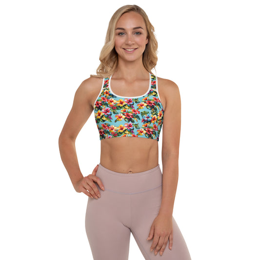 A picture of a woman modeling a Hawaiian Hibiscus Flower pattered Padded Sports Bra with white piping  - front