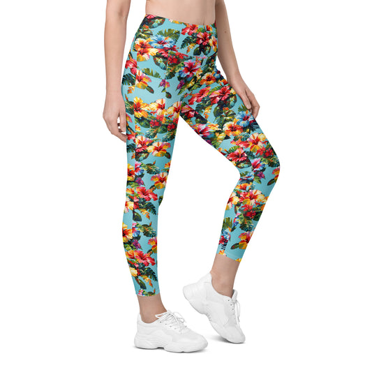 A picture of a woman modeling a Hawaiian Hibiscus Flower pattered Leggings with Pockets - right-front
