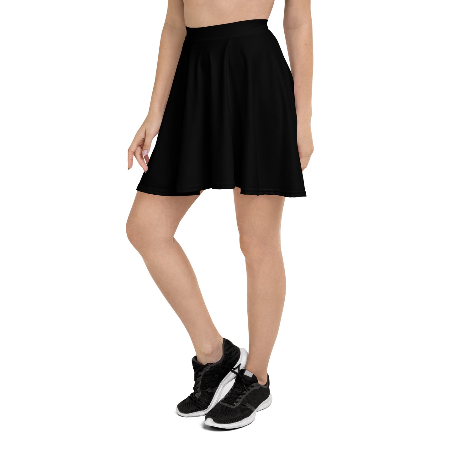 A picture of a woman waist down wearing a Products "Black" Skater Skirt and black shoes - left side