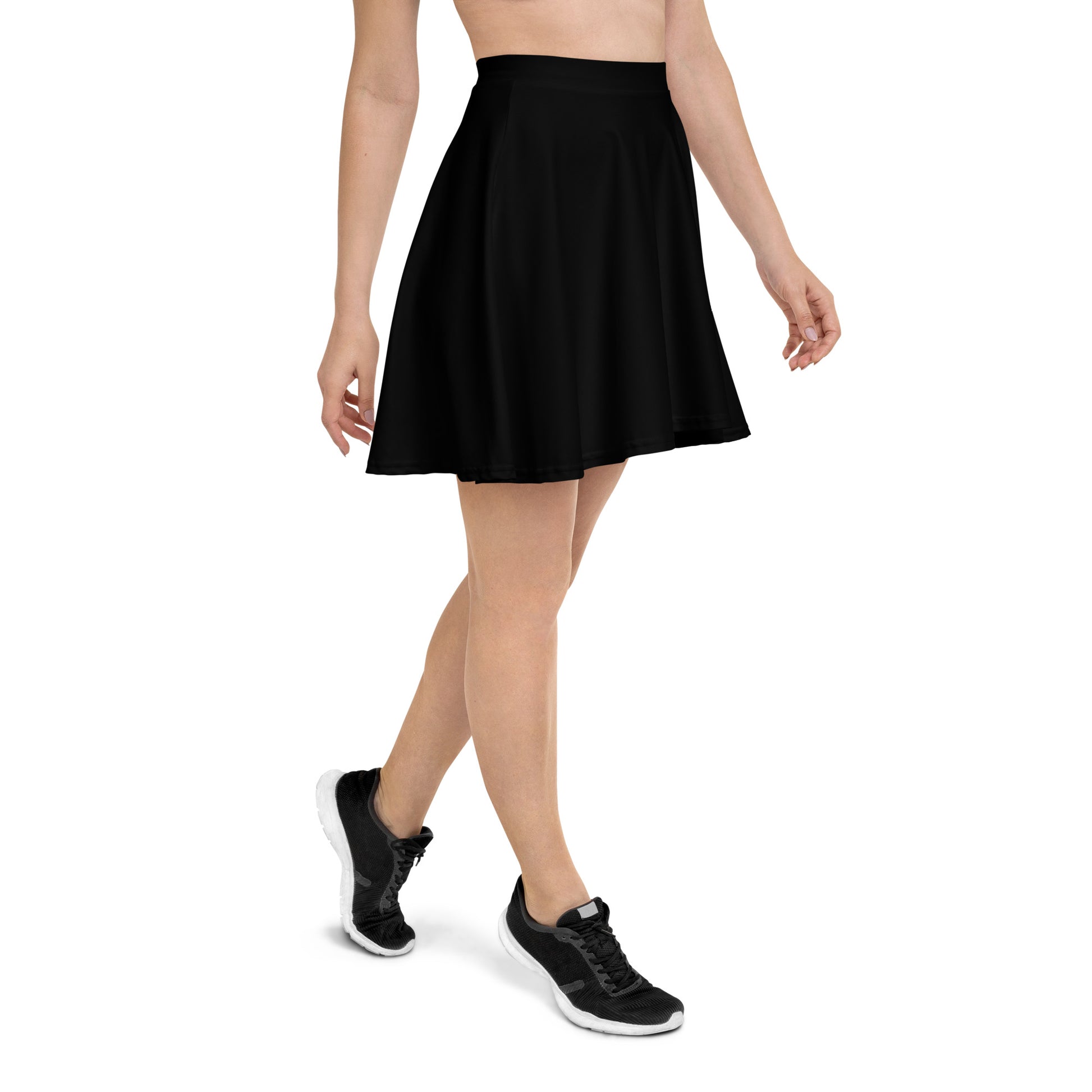 A picture of a woman waist down wearing a Products "Black" Skater Skirt and black shoes - right side