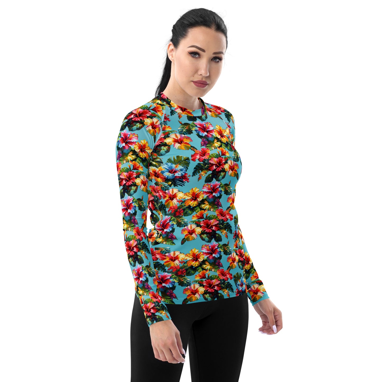A picture of a woman modeling a Hawaiian Hibiscus Flower patterned Women's Rash Guard - right front
