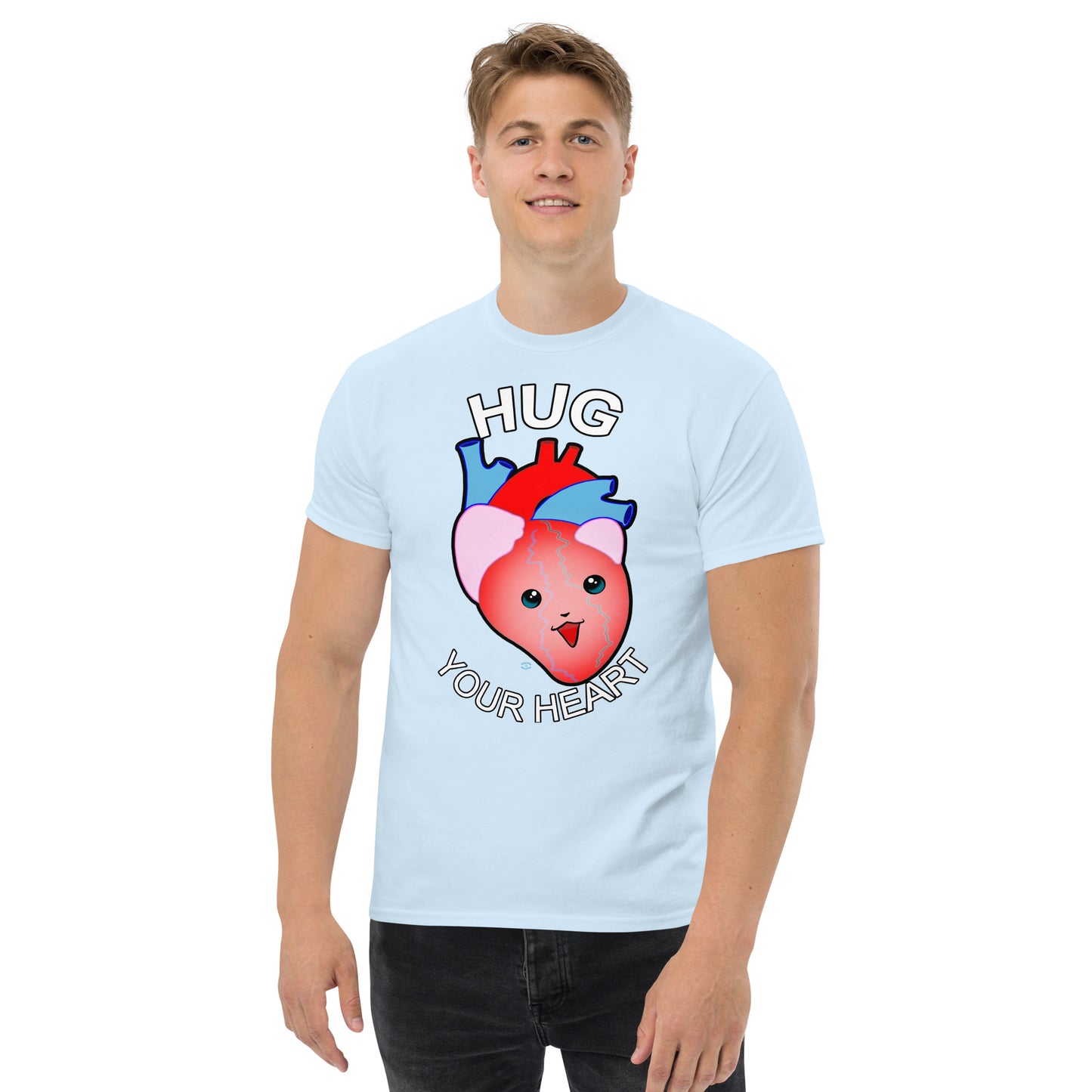 A Picture of a man wearing a short sleeved tshirt with a picture on the front of a smiling heart with the text "HUG Your Heart" - color light blue