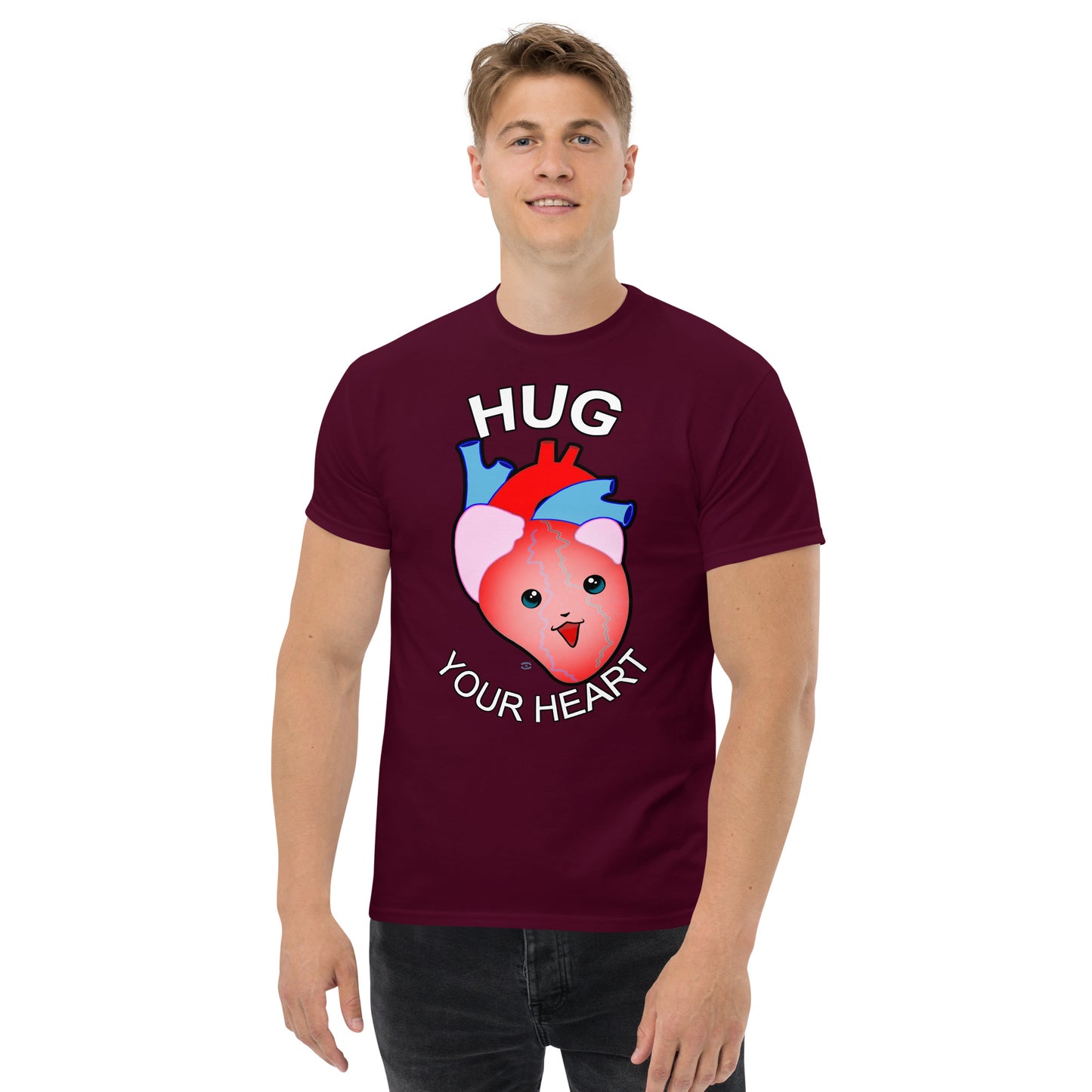 A Picture of a man wearing a short sleeved tshirt with a picture on the front of a smiling heart with the text "HUG Your Heart" - color maroon