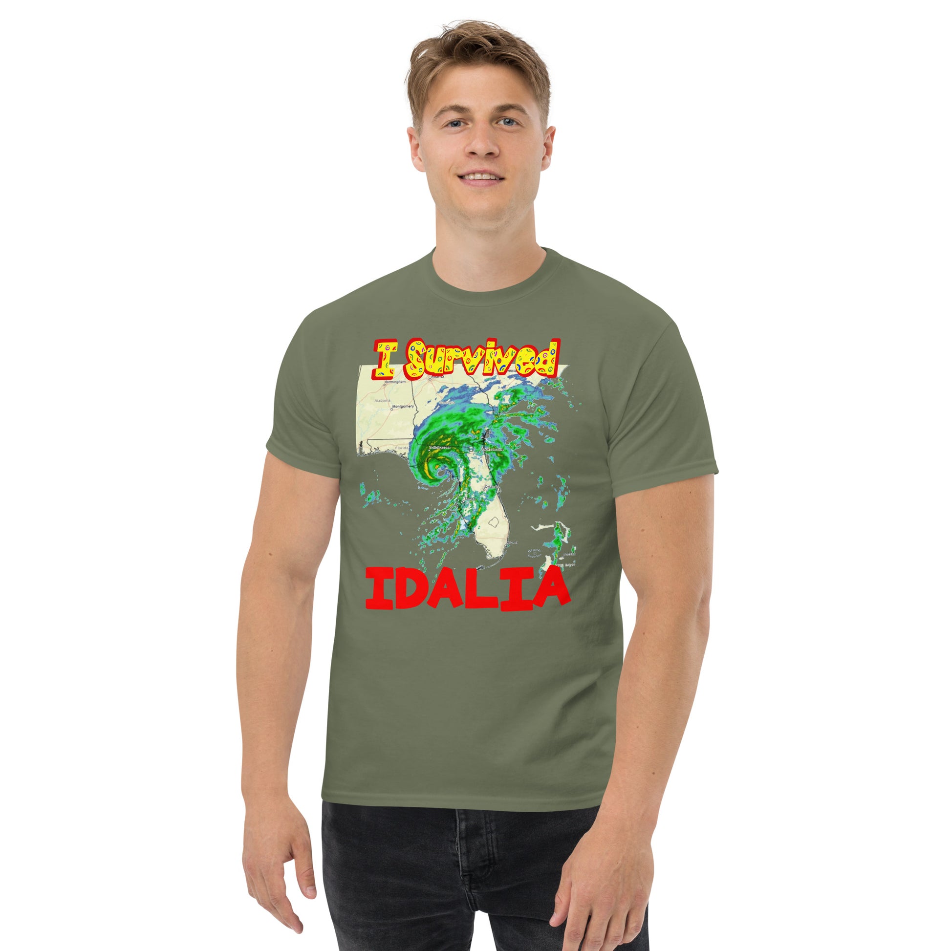 A picture of a man wearing a tshirt with I SURVIVED Hurricane IDALIA Unisex T-Shirt - in military green