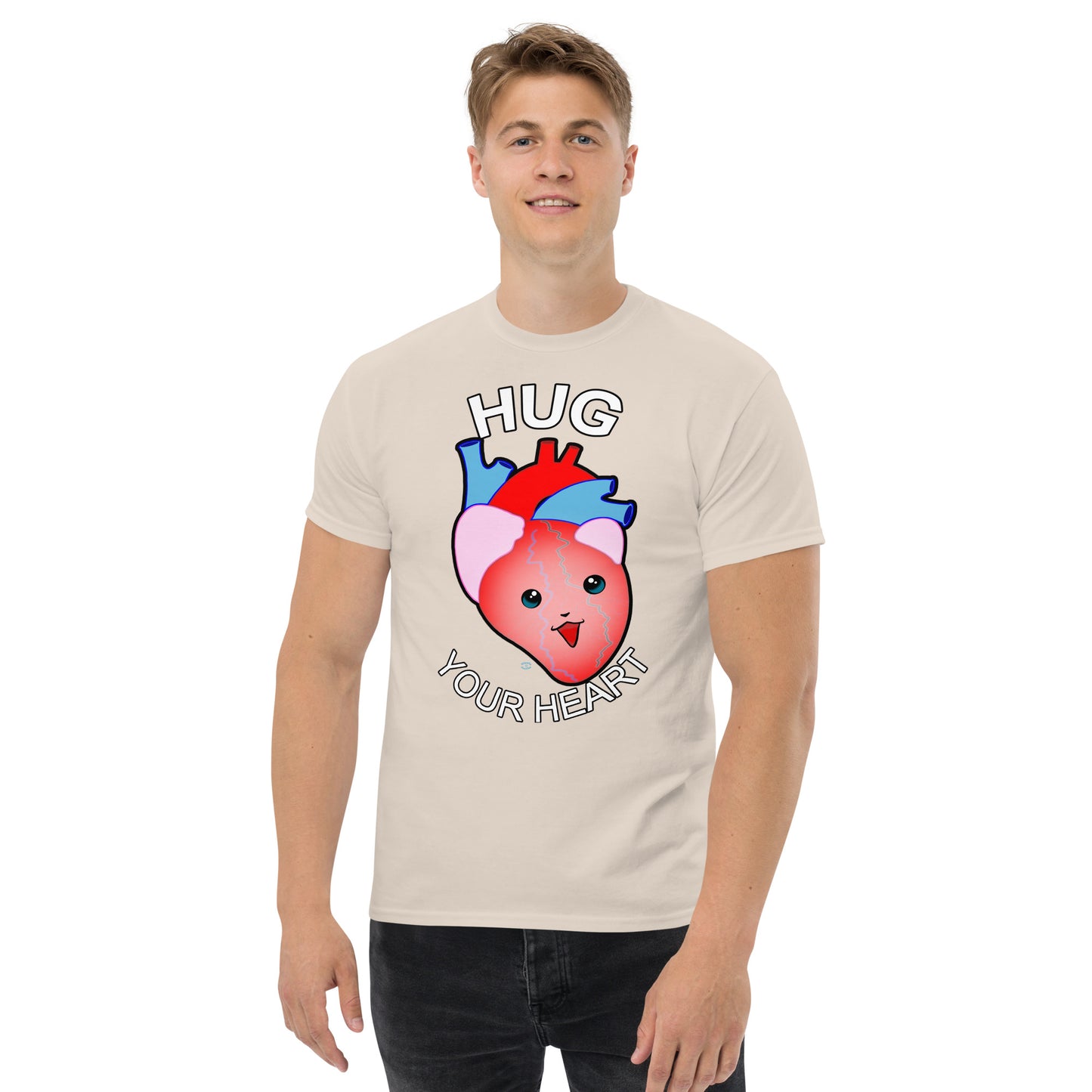 A Picture of a man wearing a short sleeved tshirt with a picture on the front of a smiling heart with the text "HUG Your Heart" - color natural cream
