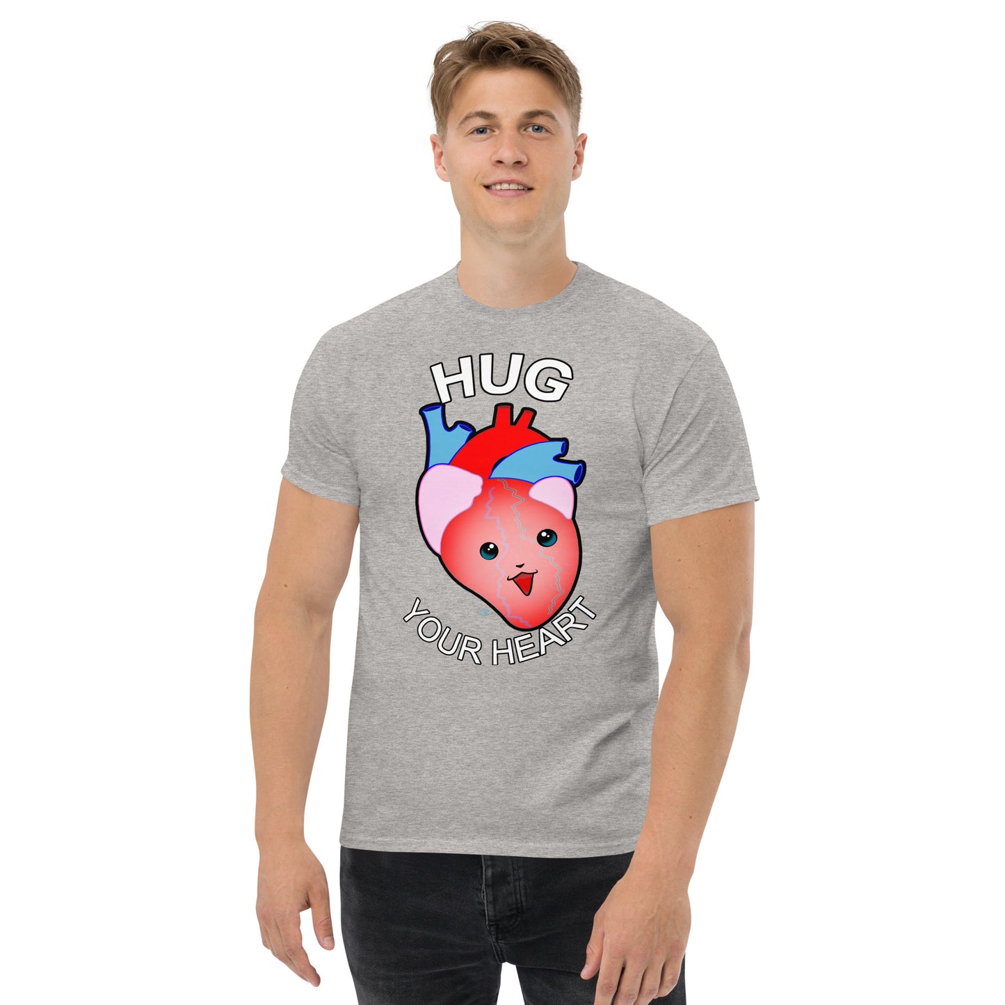 A Picture of a man wearing a short sleeved tshirt with a picture on the front of a smiling heart with the text "HUG Your Heart" - color sport grey