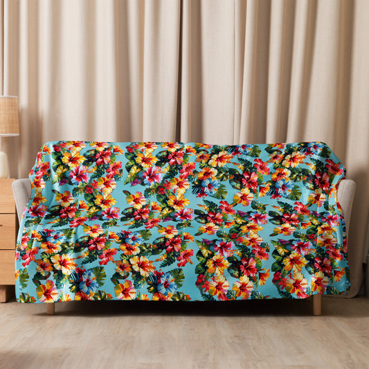A picture of a Hawaiian Hibiscus Flower patterned Sherpa Blanket spread on on a sofa - 60 x 80 inch - front