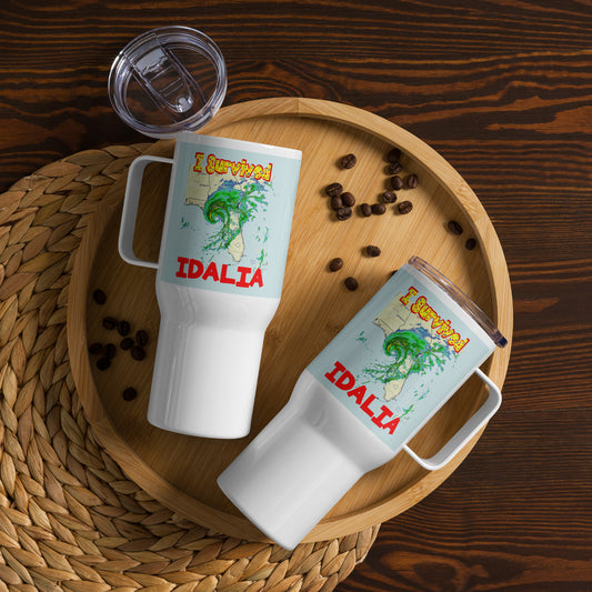 A picture of 2 travel mugs laying on a serving tray with a few coffee beans on the tray pictured on both sides of the mug is I Survived Hurricane Idalia Travel mug with a handle 25 oz