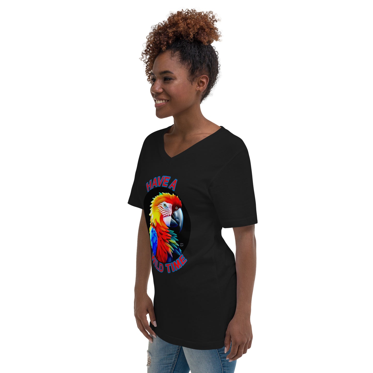 A picture of a women wearing a tshirt with the picture of a bright and colorful rainbow macaw parrot and the text HAVE A WILD TIME - black left front