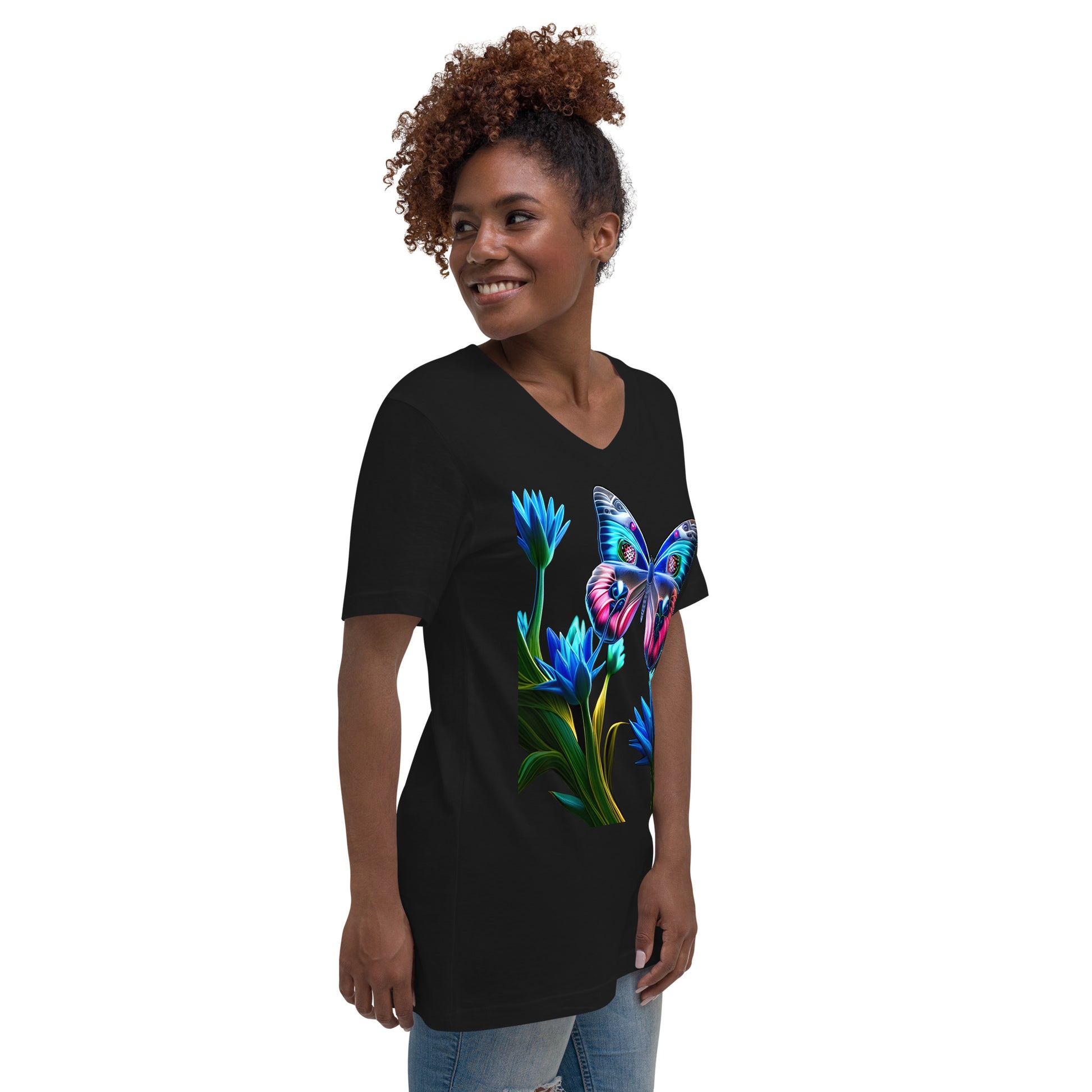 A picture of a woman wearing a v-neck short sleeve tshirt with a picture of a very colorful butterfly and flowers on the front - black - right front side