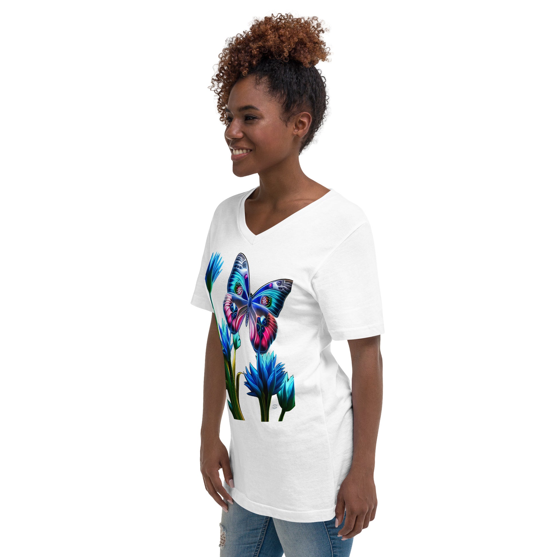 A picture of a woman wearing a v-neck short sleeve tshirt with a picture of a very colorful butterfly and flowers on the front - white - left front side