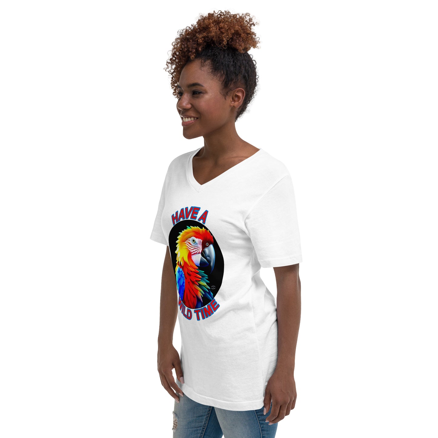 A picture of a women wearing a tshirt with the picture of a bright and colorful rainbow macaw parrot and the text HAVE A WILD TIME - white left front
