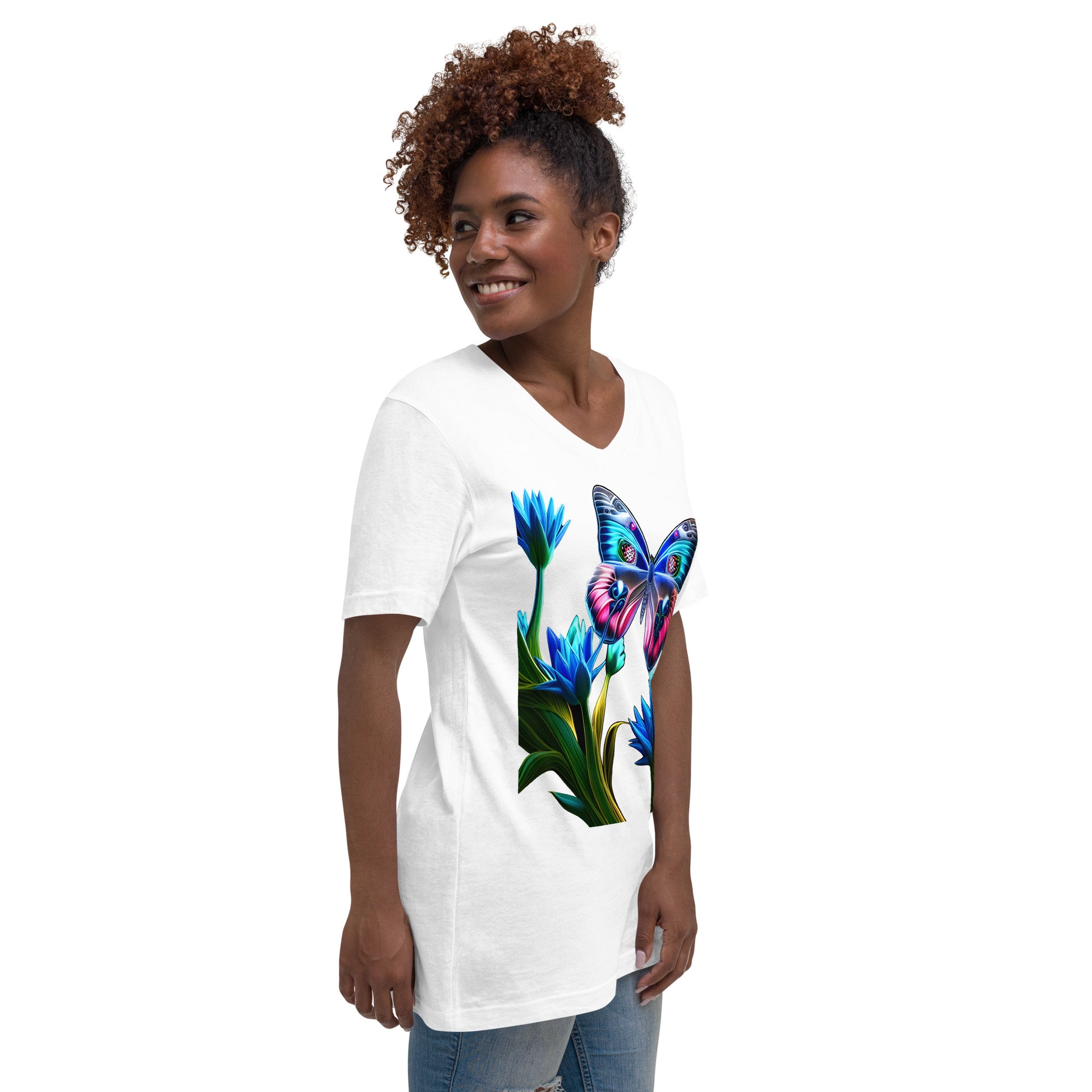 A picture of a woman wearing a v-neck short sleeve tshirt with a picture of a very colorful butterfly and flowers on the front - white - right front side