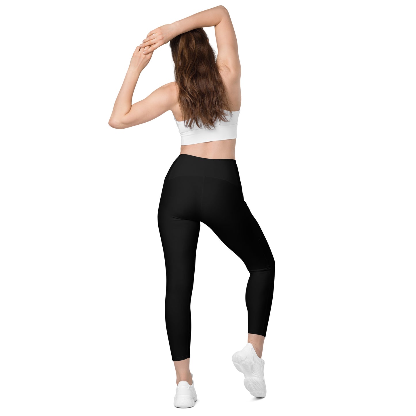 A picture of a woman standing in a yoga pose wearing Black Leggings with Pockets - back side