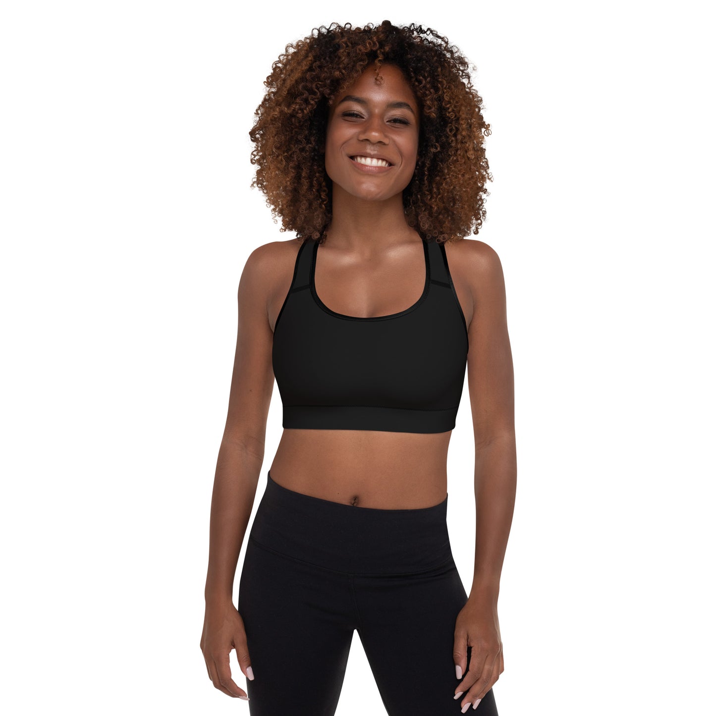 A picture of a women looking at the camera wearing a Black padded sports bra - crop top - front side