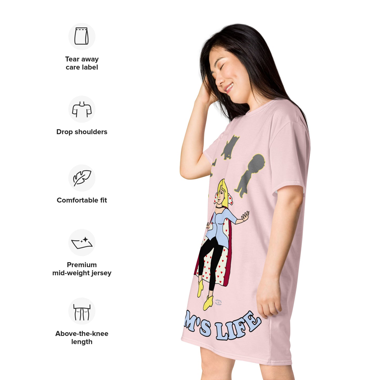 A women wearing a short sleeve tshirt dress which has on the front a cartoon women in a cape juggling her family like a jester and the text Mom's LIFE - left front - light pink