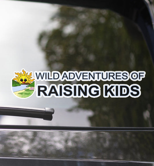 I picture of the back window of a car with Wild Adventures of Raising Kids" Long Bubble-free stickers across the glass