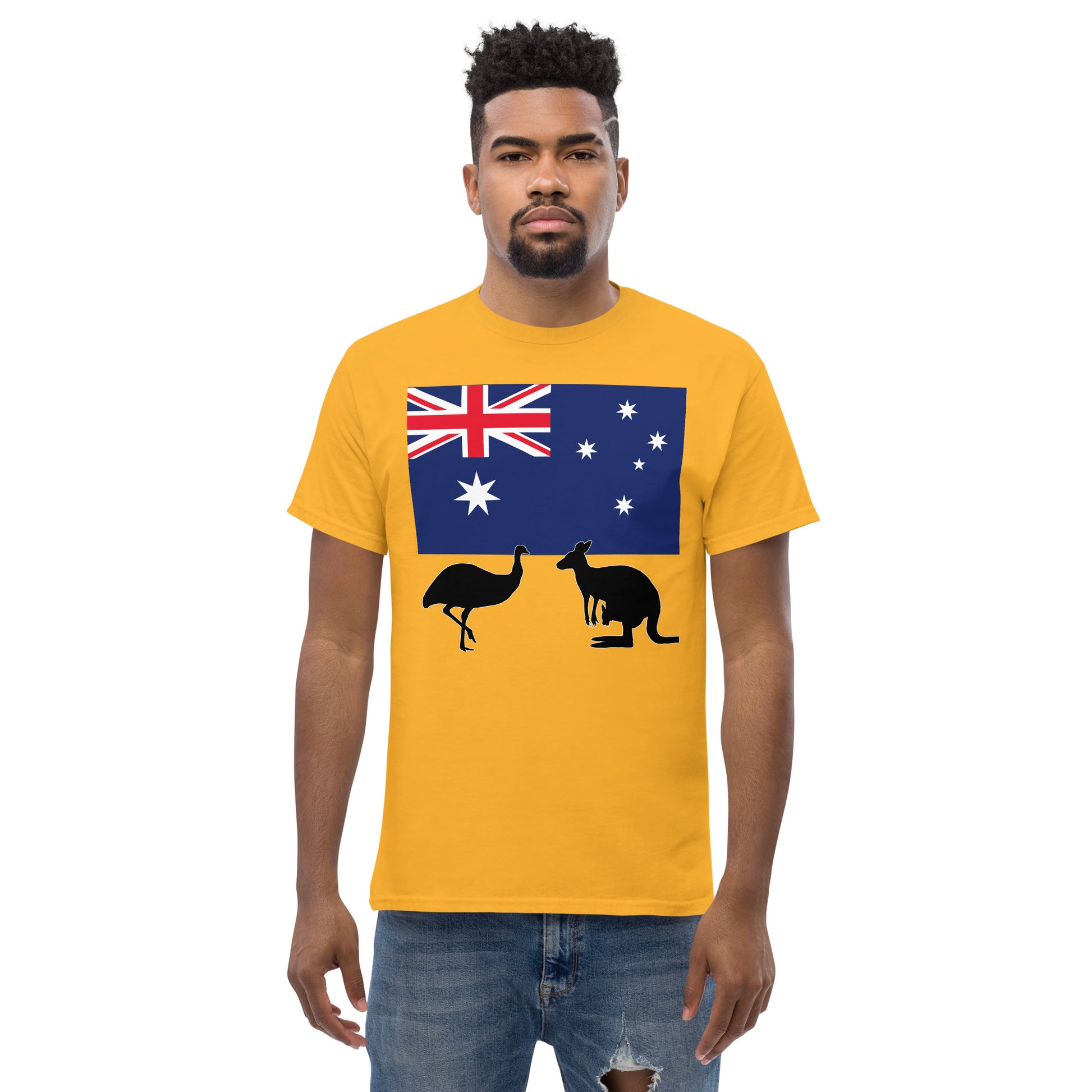 A man wearing a short sleeve tshirt and on the front is Australian flag on the front of a tshirt with the Australian Flag and the silhouettes of an Emu and a kangaroo below - Shirt color gold