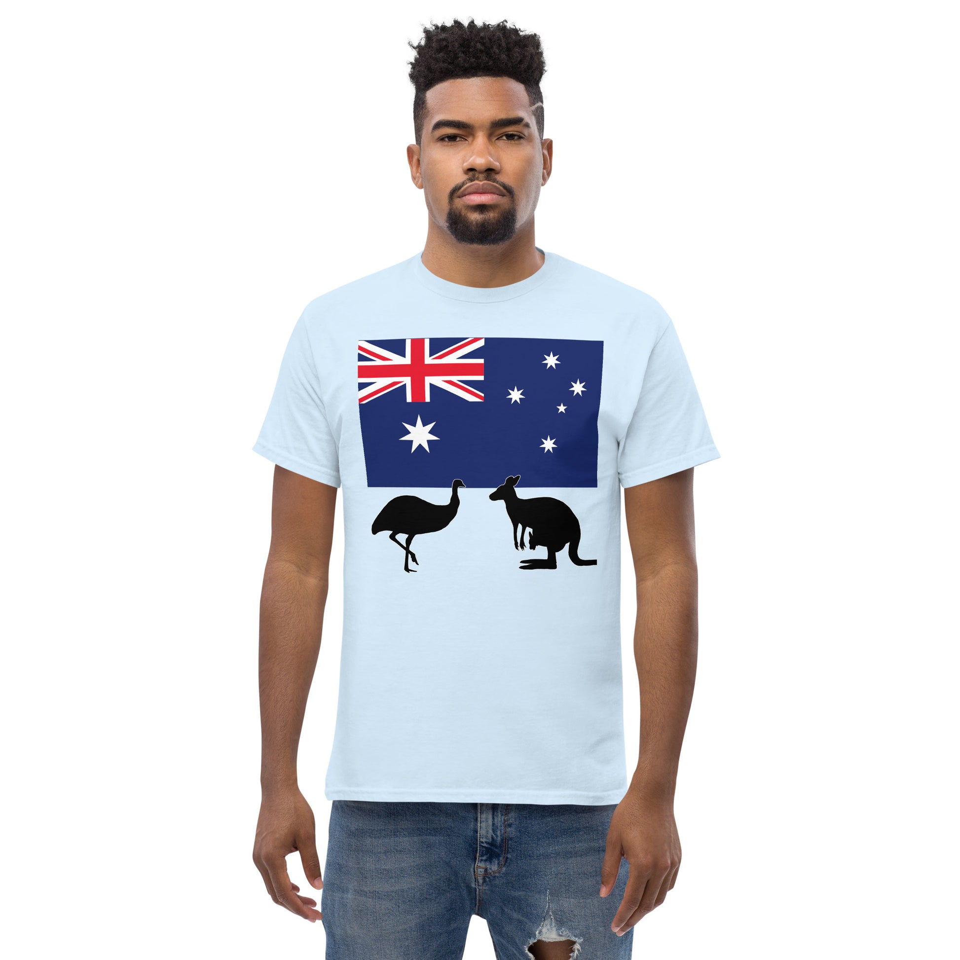 A man wearing a short sleeve tshirt and on the front is Australian flag on the front of a tshirt with the Australian Flag and the silhouettes of an Emu and a kangaroo below - Shirt color light blue