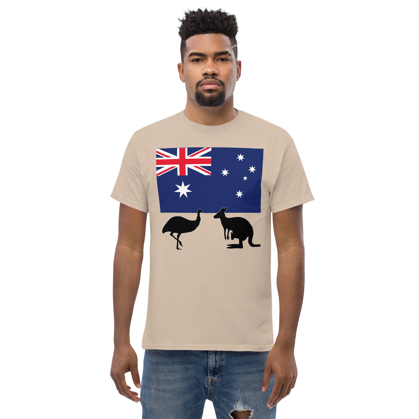 A man wearing a short sleeve tshirt and on the front is Australian flag on the front of a tshirt with the Australian Flag and the silhouettes of an Emu and a kangaroo below - Shirt color sand