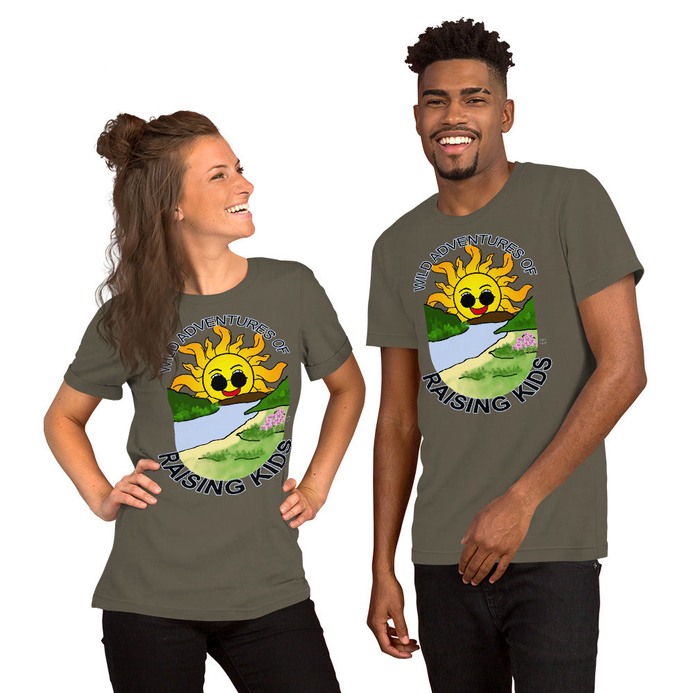 A man and a woman wearing matching tshirts with a picture of the sun coming up over the mountains with sunglasses on and a little stream gently flowing trees and bushes can be seen on the closer mountains and a small beach with some flowers are on the closes bank around the outside of the picture is written "Wild Adventures of Raising Kids" unisex tshirt - army green front