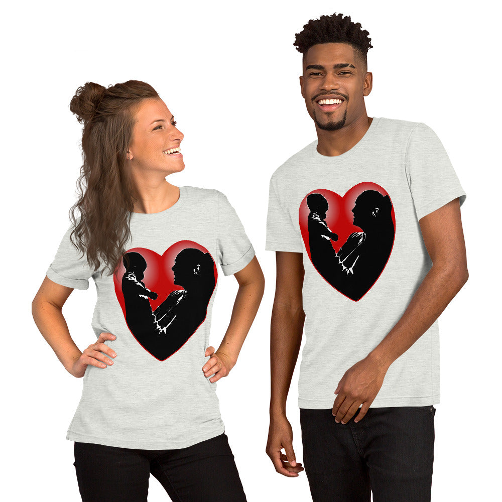 A man and a women wearing matching short sleeve tshirt with a picture on the front of a mother holding up a baby in silhouette with white light shining from behind and a red love heart framing them - Front - ash grey