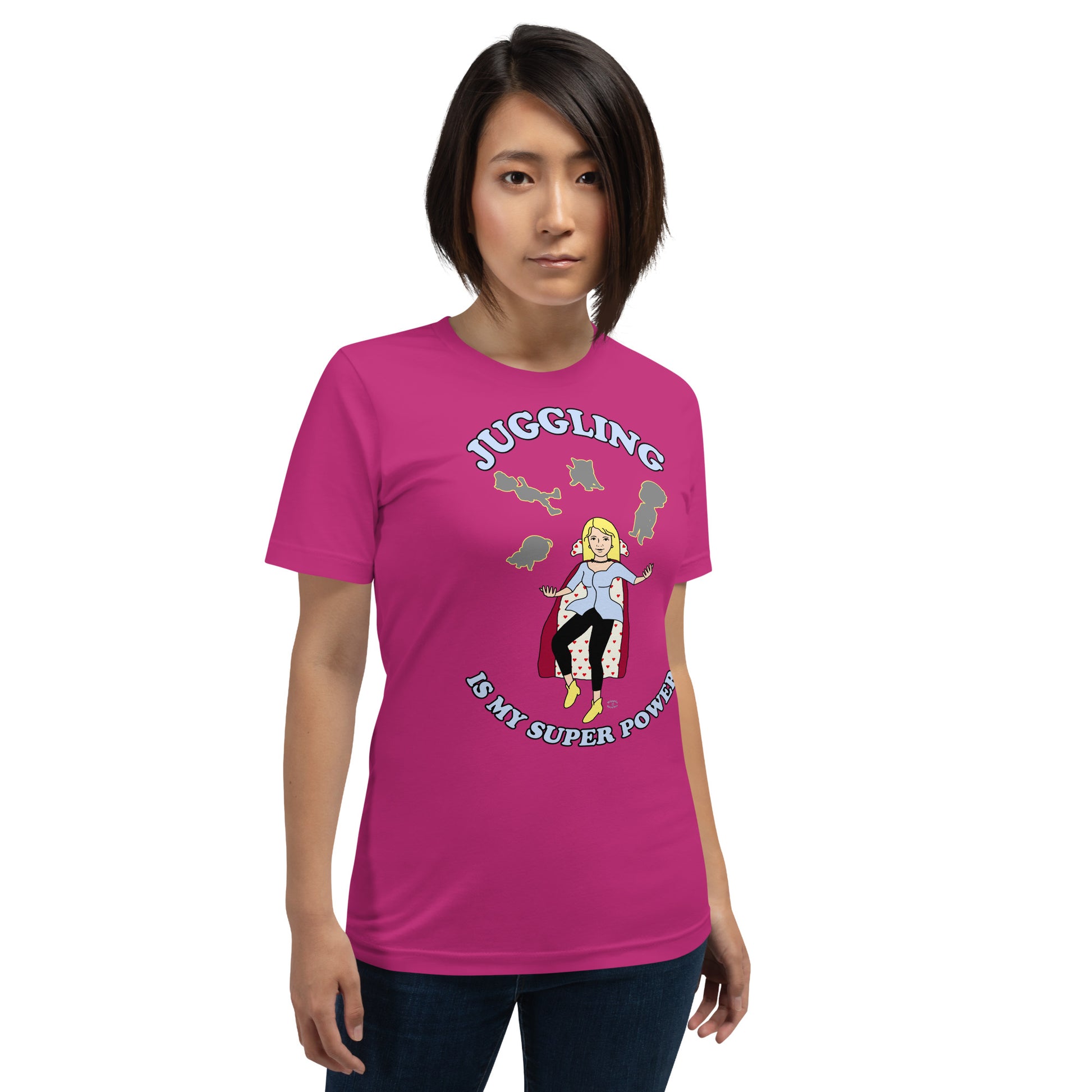 A women wearing a unisex short sleeve tshirt which has on the front a cartoon women in a cape juggling her family like a jester and the text Juggling Is My Super Power - front - berry pink