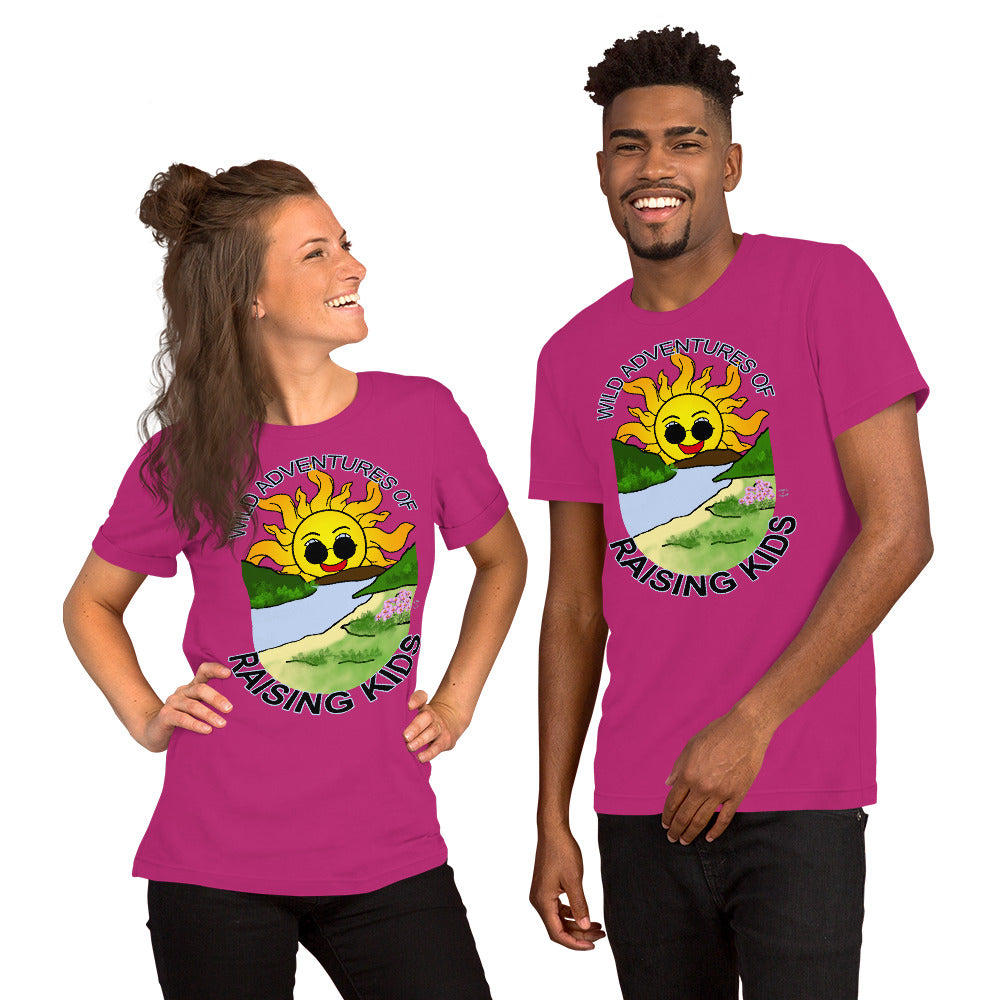 A man and a woman wearing matching tshirts with a picture of the sun coming up over the mountains with sunglasses on and a little stream gently flowing trees and bushes can be seen on the closer mountains and a small beach with some flowers are on the closes bank around the outside of the picture is written "Wild Adventures of Raising Kids" unisex tshirt - berry pink front