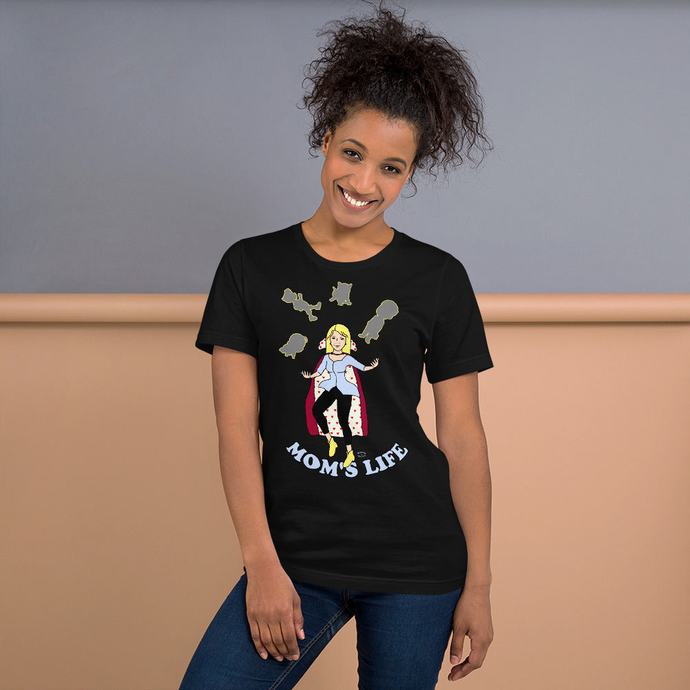 A women wearing a short sleeve unisex tshirt with a pictuer on the front of a mother in a cape juggling her family with the text at the bottom Mom's Life - Front - black