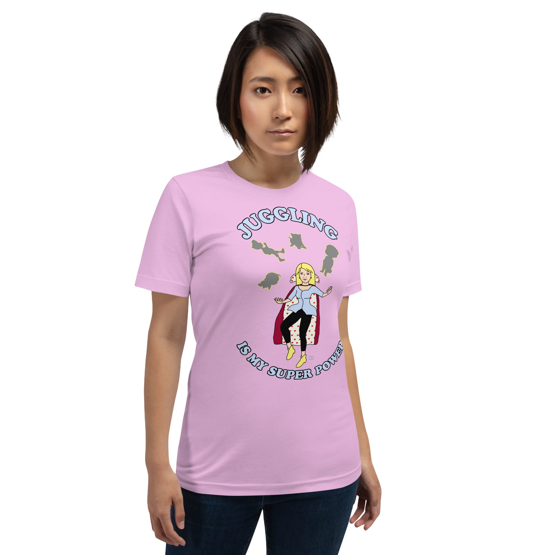 A women wearing a unisex short sleeve tshirt which has on the front a cartoon women in a cape juggling her family like a jester and the text Juggling Is My Super Power - front - lilac