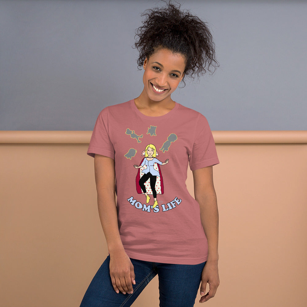 A women wearing a short sleeve unisex tshirt with a pictuer on the front of a mother in a cape juggling her family with the text at the bottom Mom's Life - Front - mauve