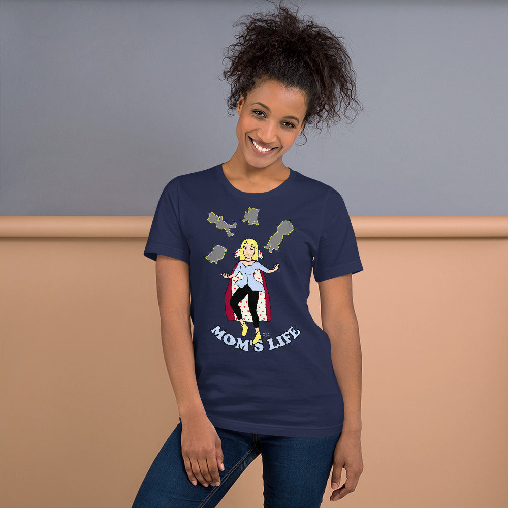 A women wearing a short sleeve unisex tshirt with a pictuer on the front of a mother in a cape juggling her family with the text at the bottom Mom's Life - Front - navy blue