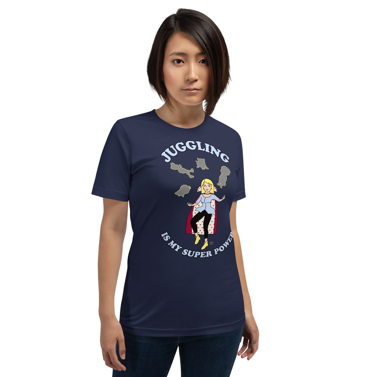 A women wearing a unisex short sleeve tshirt which has on the front a cartoon women in a cape juggling her family like a jester and the text Juggling Is My Super Power - front - navy