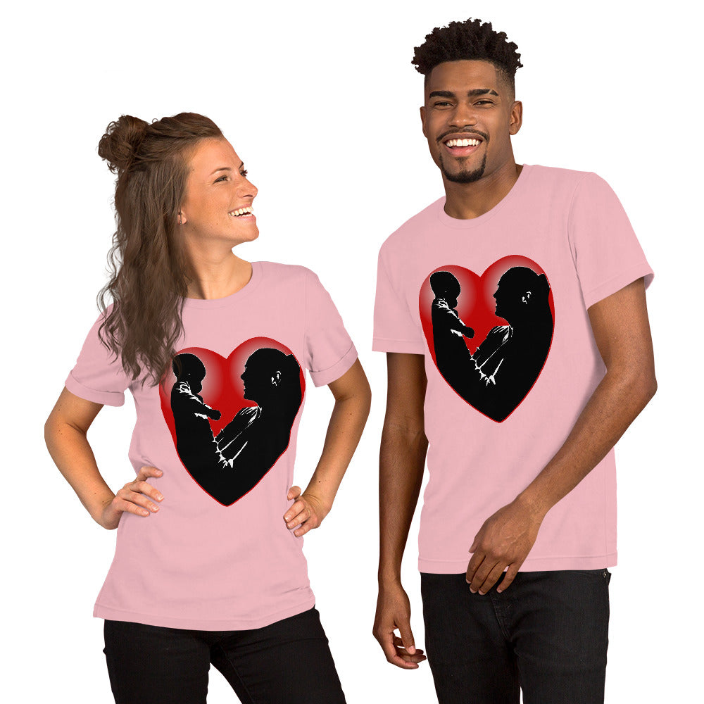 A man and a women wearing matching short sleeve tshirt with a picture on the front of a mother holding up a baby in silhouette with white light shining from behind and a red love heart framing them - Front - pink