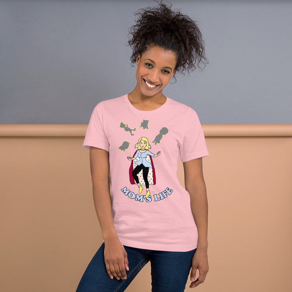 A women wearing a short sleeve unisex tshirt with a pictuer on the front of a mother in a cape juggling her family with the text at the bottom Mom's Life - Front - pink