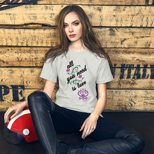 A picture of a woman wearing a short sleeve tshirt text and cute rosemaling art - shirt color is silver 