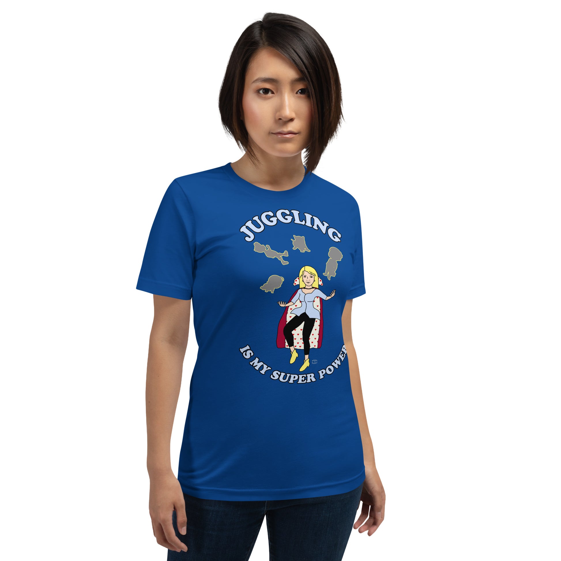 A women wearing a unisex short sleeve tshirt which has on the front a cartoon women in a cape juggling her family like a jester and the text Juggling Is My Super Power - front - royal blue